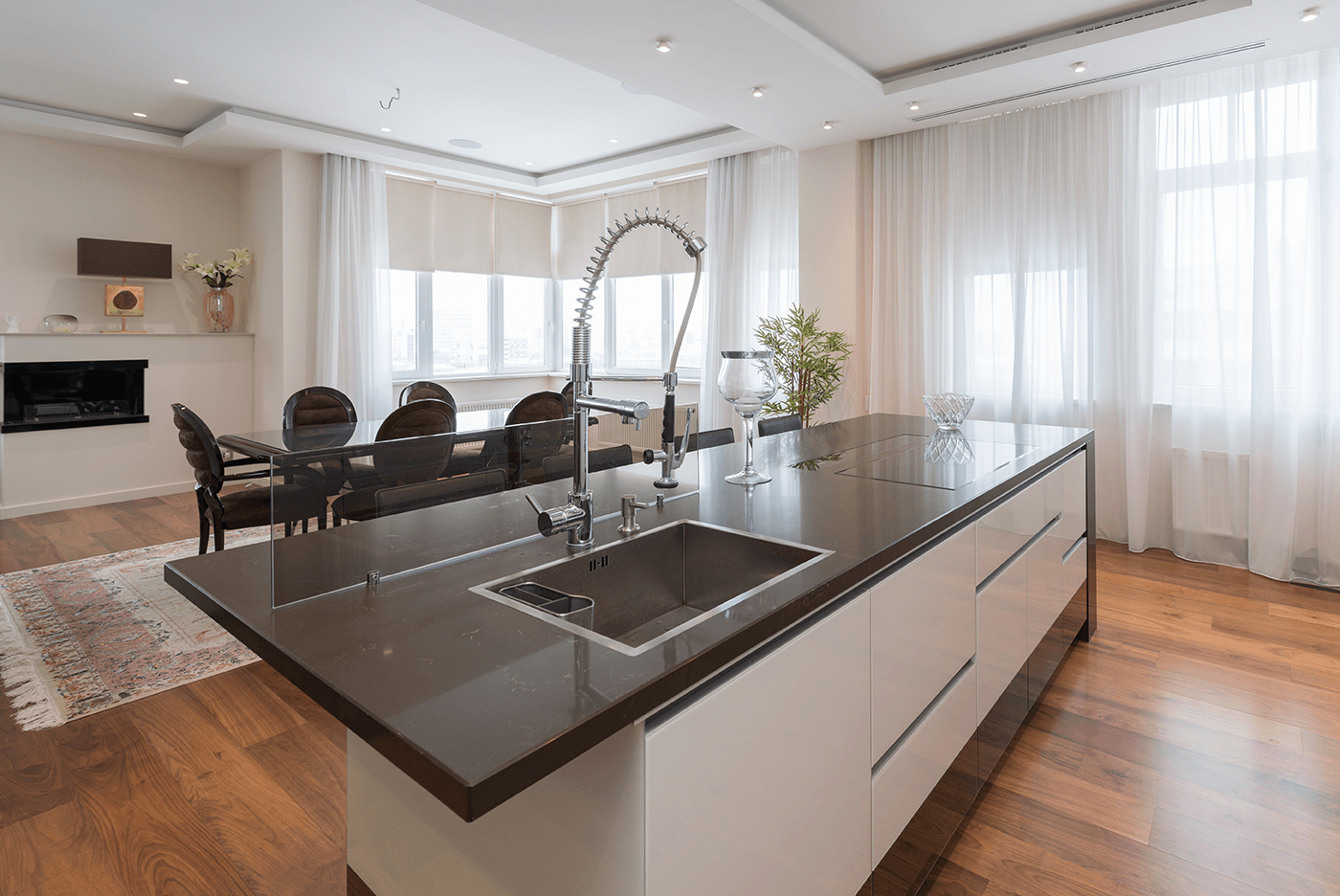 A Kitchen Island Featuring a Hob and Sink Combo