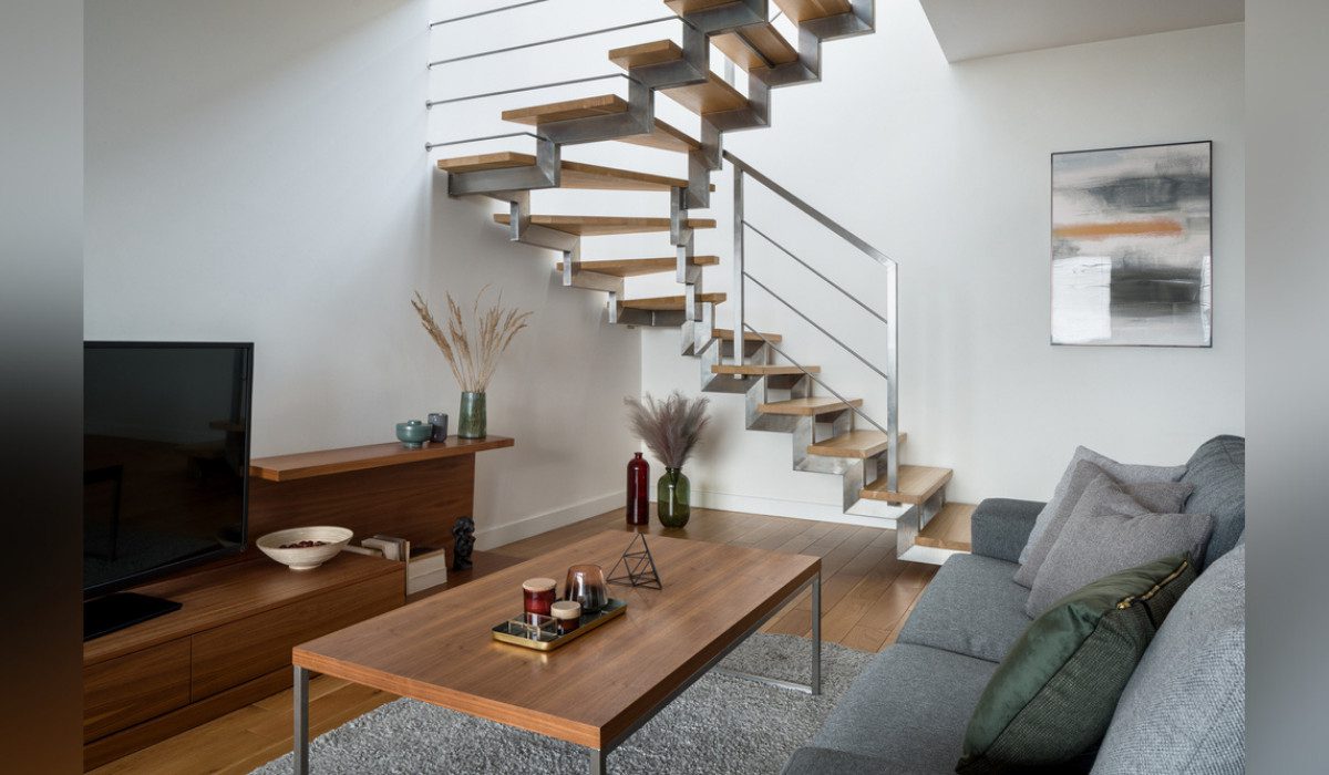 A Living Room Featuring Stairs in the Layout